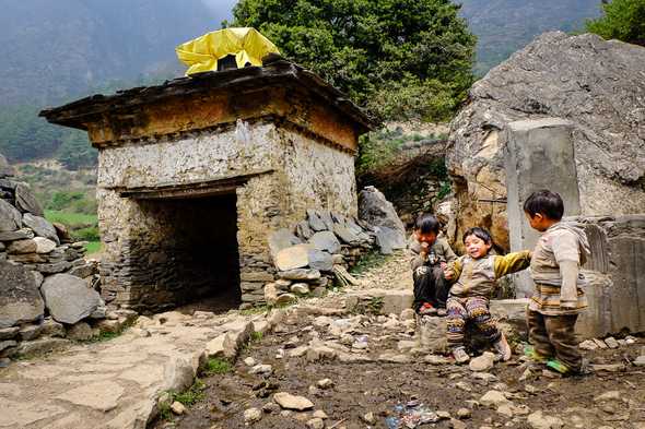 Children playing by the village gate. Tsum Valley, Nepal