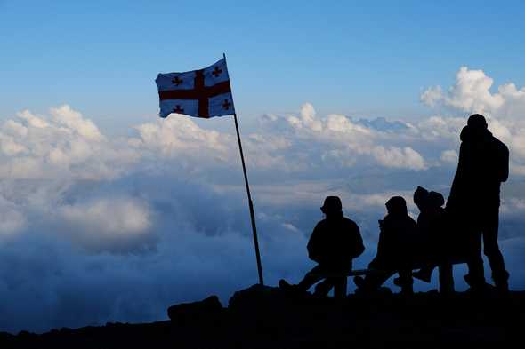 Watching the cloud cinema in front of the Meteo station. On the way up Mount Kazbek