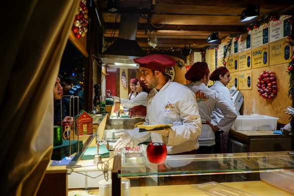 Serving lángos. Gendarmenmarkt Christmas market, Berlin