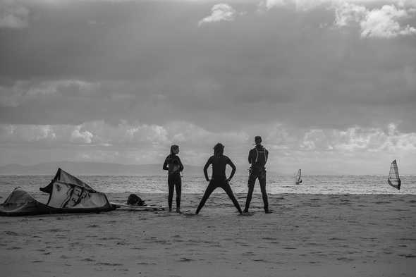 Kitesurfers on a Tarifa beach, Spain