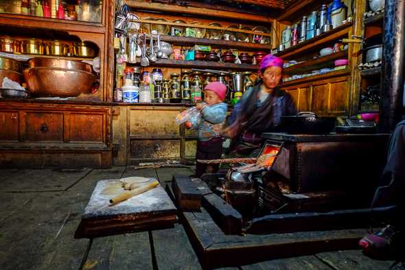 Cooking some tibetan bread. Tsum Valley, Nepal